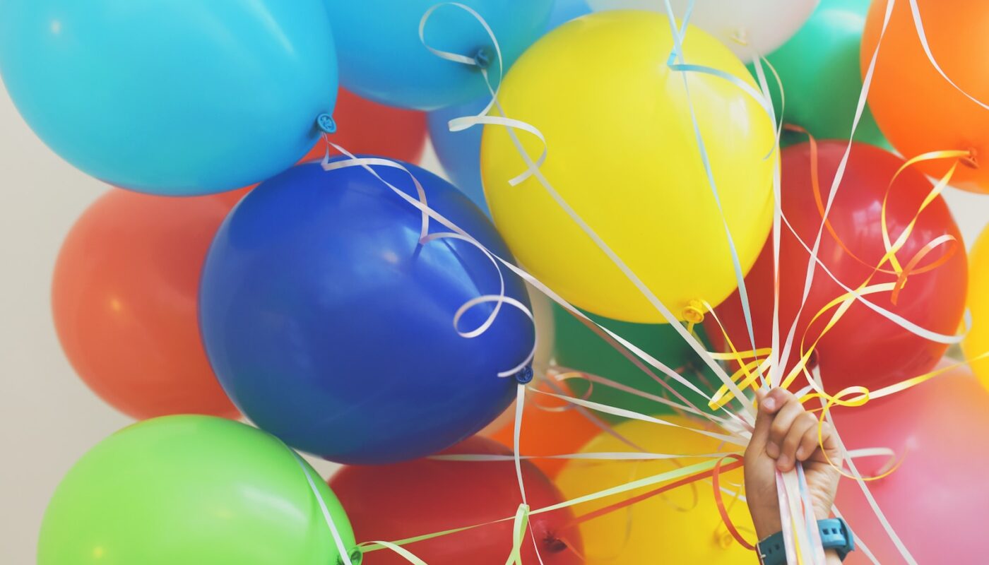 person holding balloons