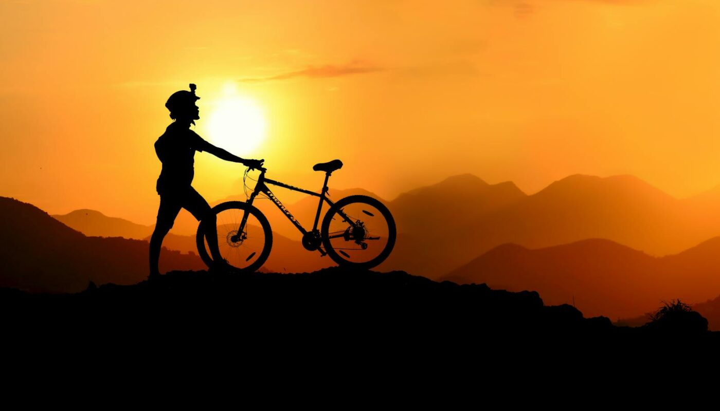 Silhouette Photography of Biker on Top of Hill